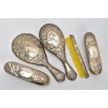 A FIVE PIECE SILVER VANITY SET, comprising of a hair brush, round hand held mirror, two clothes