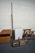 A PAIR OF PINE FOLDING TRESTLE STANDS, along with a teak two door cabinet, teak slope, table, two