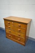 AN EDWARDIAN OAK CHEST OF TWO OVER THREE LONG DRAWERS, width 108cm x depth 56cm x height 101cm (