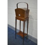 AN EDWARDIAN MAHOGANY SEWING BOX, on a square tapered stand united by an undershelf, width 26cm x