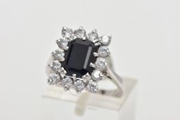 A 9CT WHITE GOLD CLUSTER RING, designed with a central rectangular cut blue sapphire, in a
