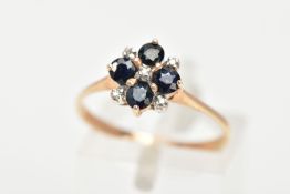 A 9CT GOLD SAPPHIRE AND DIAMOND RING, four circular cut blue sapphires set with five round brilliant