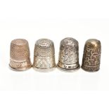 FOUR THIMBLES, to include a 'Charles Horner' thimble hallmarked Chester 1906, 4.8 grams, one stamped