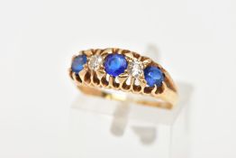 AN EARLY 20TH CENTURY 18CT GOLD FIVE STONE RING, designed with a central blue stone assessed as a