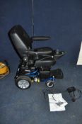 A ROMA ELITE P325 ELECTRIC WHEELCHAIR with power supply manual and original sales receipt (dated