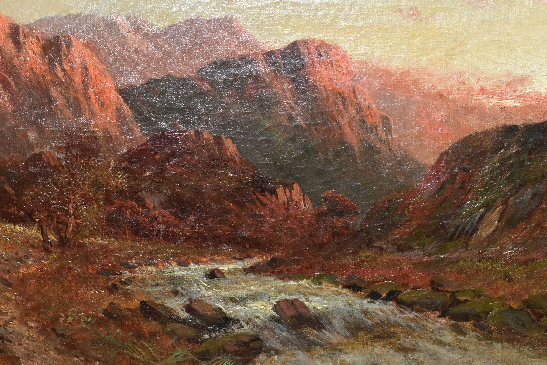 A. LEWIS (19TH/20TH CENTURY) A MOUNTAINOUS LANDSCAPE AT SUNRISE, fast flowing stream to the - Image 3 of 6