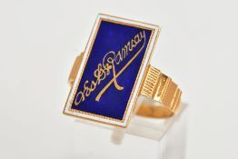 A YELLOW METAL ENAMEL RING, of a rectangular form, decorated with a blue enamel back ground and