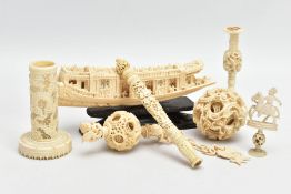 A LATE 19TH CENTURY CHINESE CARVED IVORY PUZZLE BALL ON CHAIN, with fish hook, carved links above