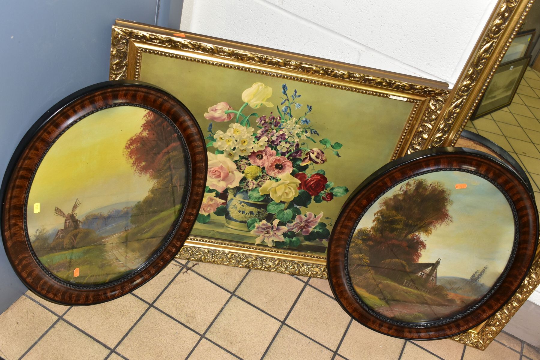 A PAIR OF EARLY 20TH CENTURY LANDSCAPE OILS ON BOARD, no visible signatures, painted oval frames,