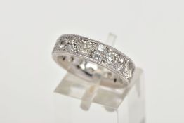 AN 18CT GOLD DIAMOND ETERNITY RING, fourteen vary cut and size diamonds in a grain set 18ct white