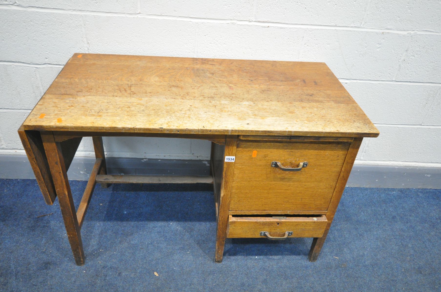 AN EARLY 20TH CENTURY 'SHANNON' OAK DESK, with a drop end, brushing slide, fall front filing door - Image 3 of 3