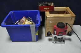 A POWER DEVIL ROUTER model No PDW5027 (PAT pass and working) along with plastic tub containing
