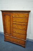 A 'BRADLEY' CHERRYWOOD GENTLEMANS CABINET, with a single cupboard door, bedside five drawers and