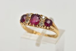 A 18CT GOLD RUBY AND DIAMOND RING, three cushion cut rubies set with four old cut diamonds in a