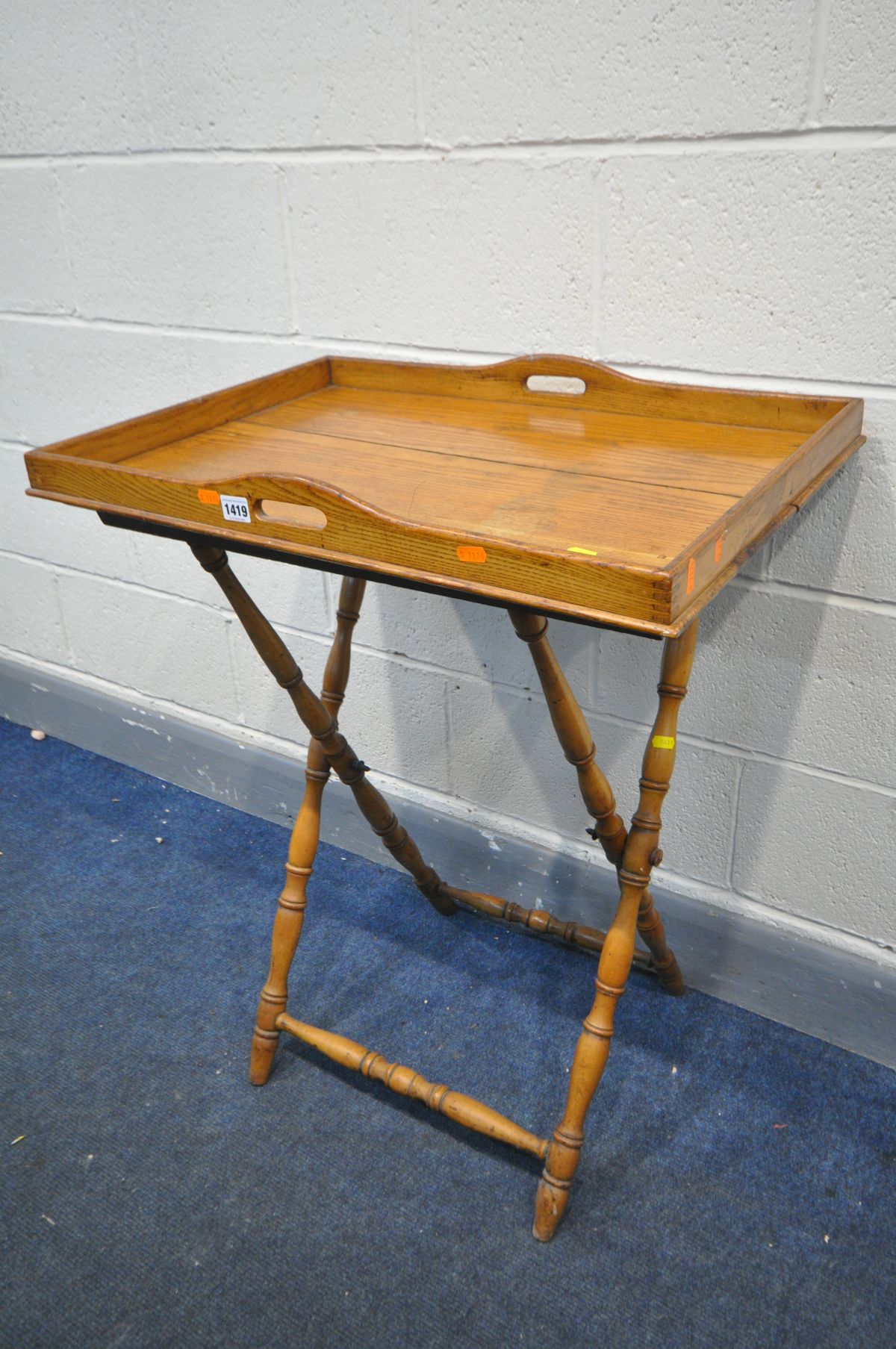 AN EARLY 20TH CENTURY OAK BUTLERS TRAY, on a folding stand, width 70cm x depth 49cm x height 86cm