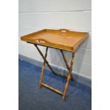 AN EARLY 20TH CENTURY OAK BUTLERS TRAY, on a folding stand, width 70cm x depth 49cm x height 86cm