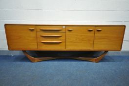 A 1960'S BEITHCRAFT TEAK SIDEBOARD, organic range, fitted with two cupboard doors that's flanking