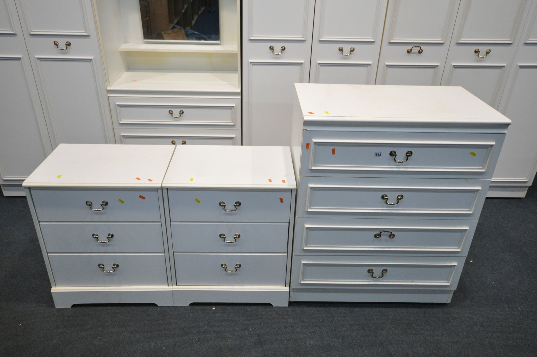 A WHITE BEDROOM SUITE, comprising a five section wardrobe fitment with top storage sections, a chest - Image 3 of 4