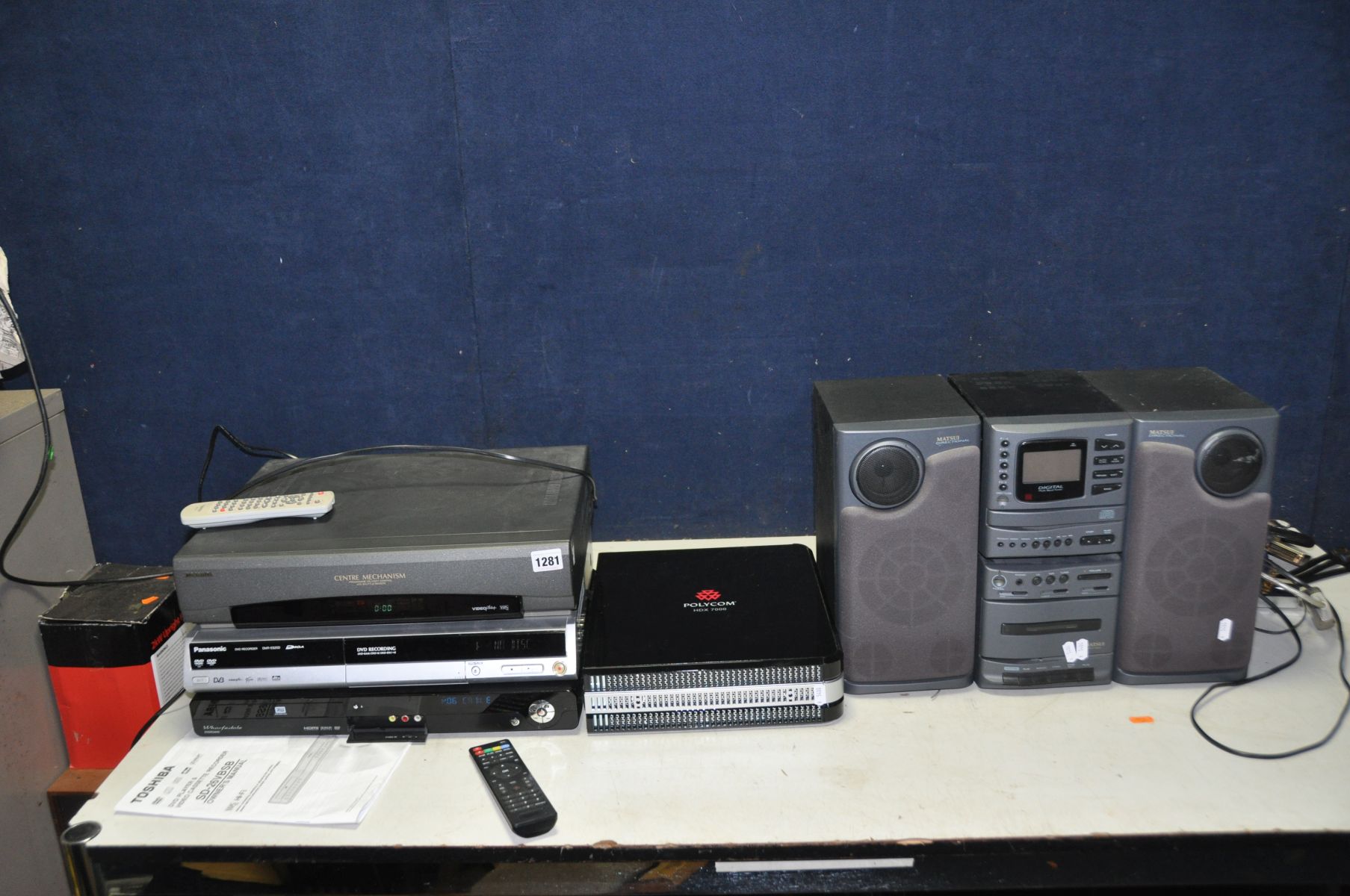 A POLYCOM HDX 7000 VIDEO CONFERENCING CONSOLE (untested), a Toshiba Video recorder with remote (tape