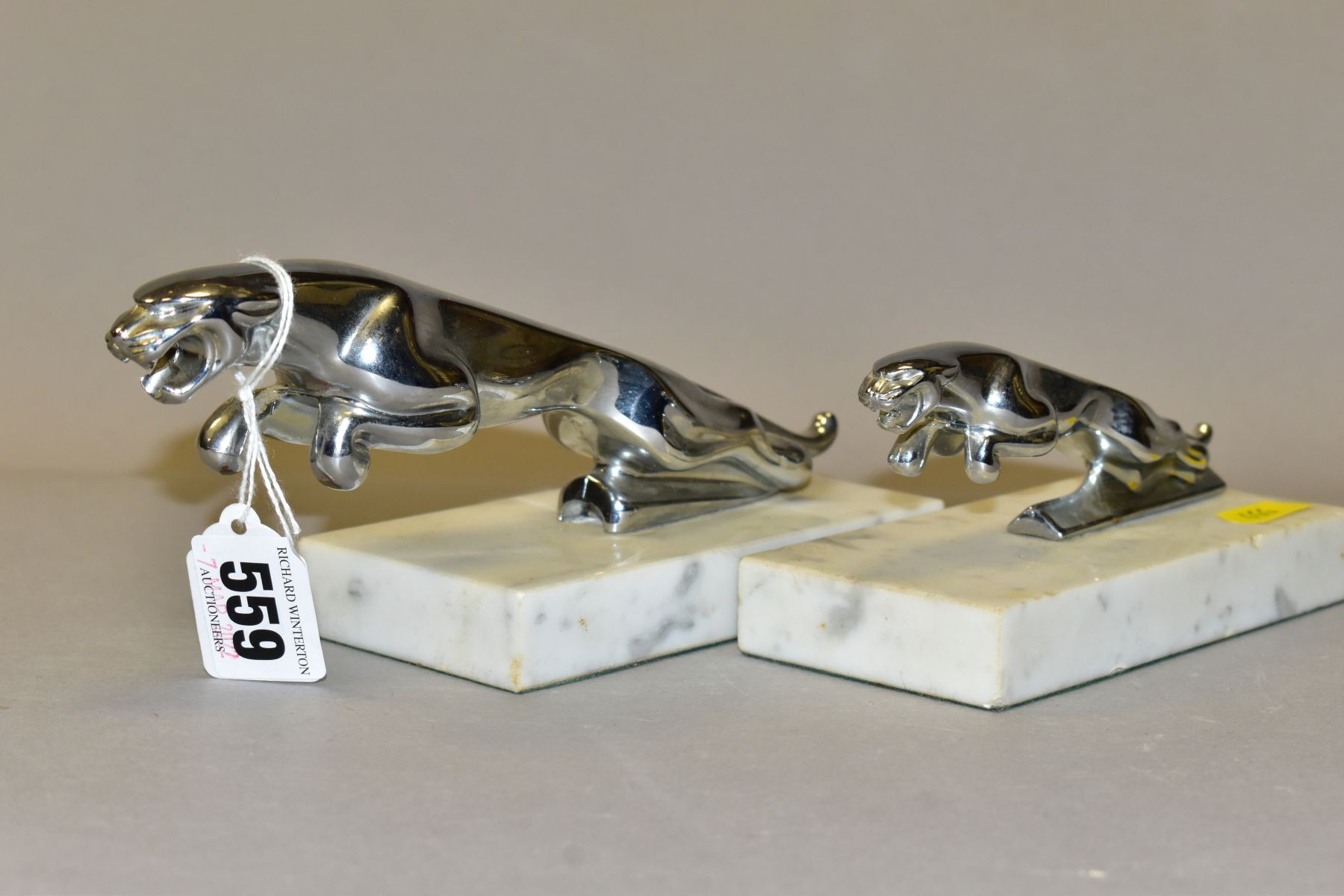 TWO CHROMED JAGUAR MASCOTS ON MARBLE PLINTHS, leaping jaguars in two different sizes, lengths 12.5cm - Image 2 of 5