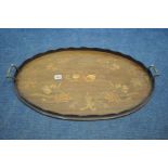 AN EDWARDIAN MAHOGANY AND MARQUETRY INLAID OVAL TRAY, with a wavy gallery and twin brass handles,