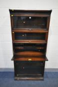A GUMM OAK FIVE SECTION BOOKCASE, comprising four up and over glazed doors and a fall front bureau