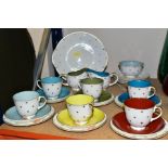 A TWENTY SEVEN PIECE SUSIE COOPER TEA SET, in Gold Star pattern, each cup having a different solid