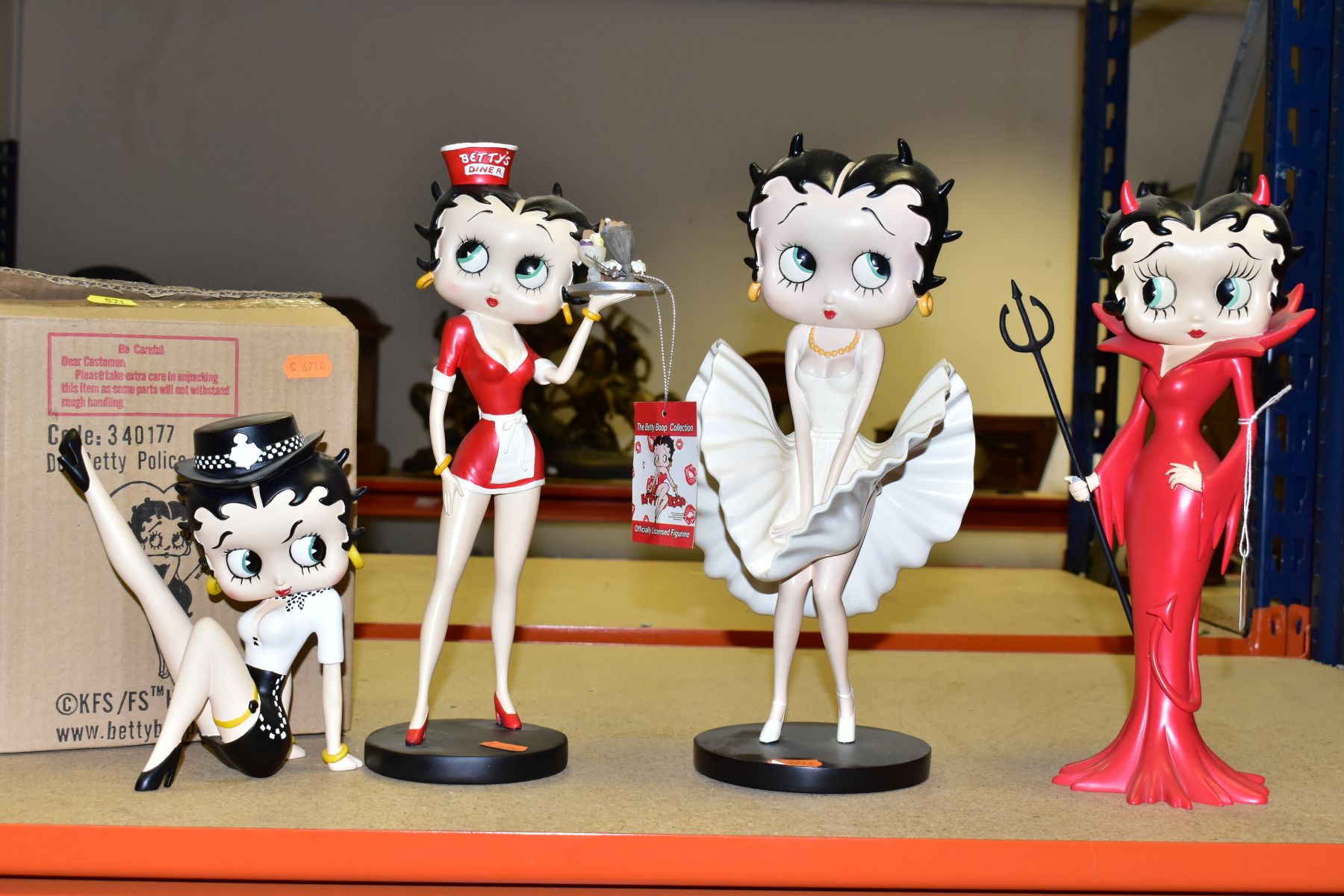 FOUR BETTY BOOP RESIN FIGURES BY KING FEATURES SYNDICATE, comprising boxed Betty Police lady leg up,