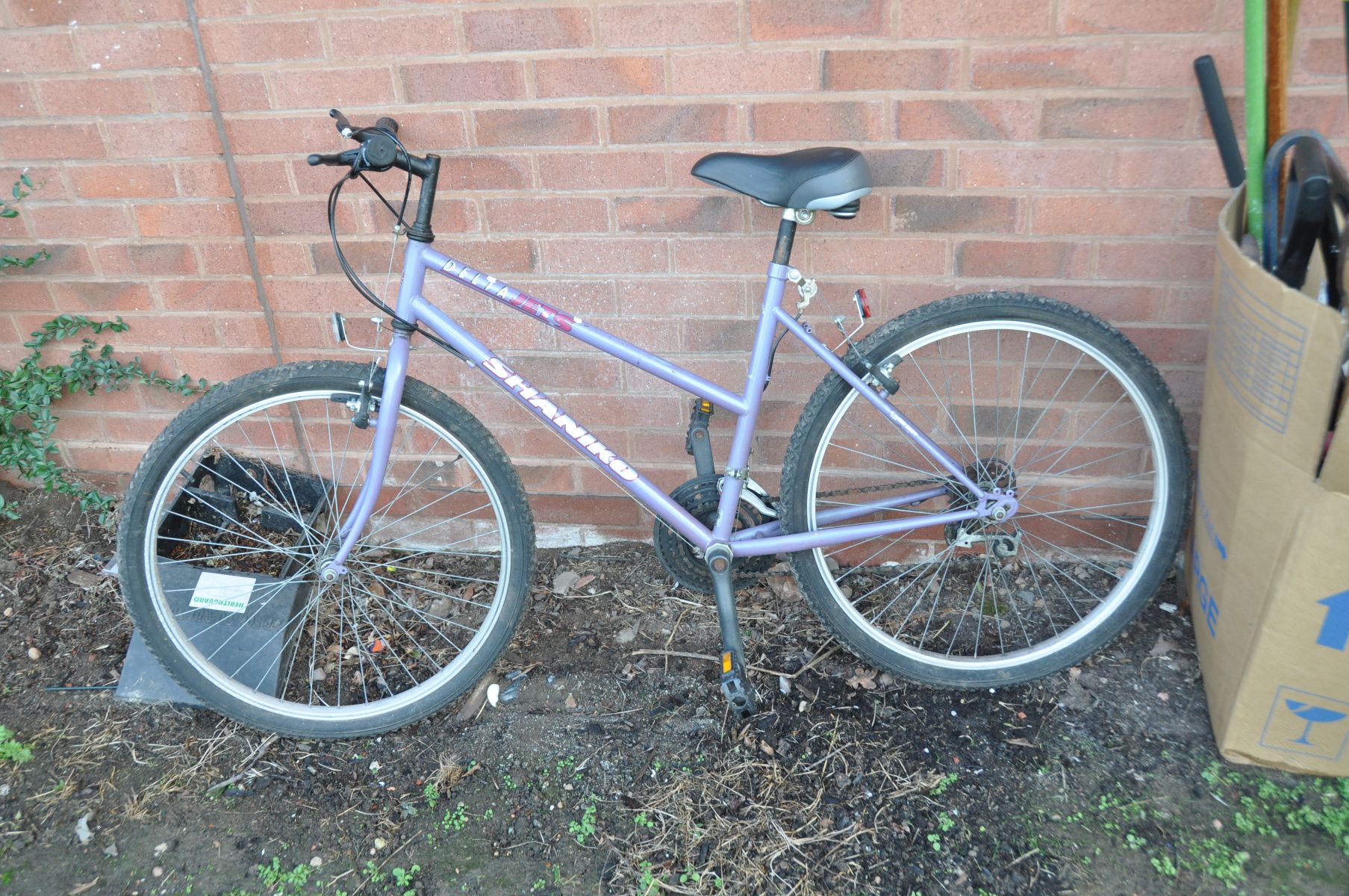 A SHANIKO DELTA JETS LADIES MOUNTAIN BIKE with 15 speed twist grip Shimano gears and a 18in frame