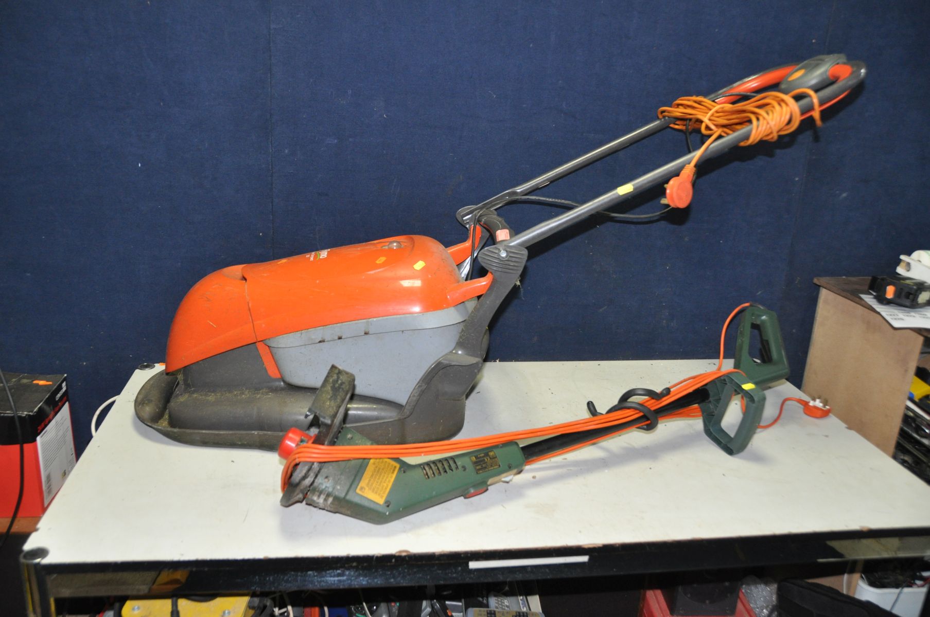 A FLYMO HOVER COMPACT 330 LAWN MOWER and a Black and Decker strimmer (both PAT pass and working)