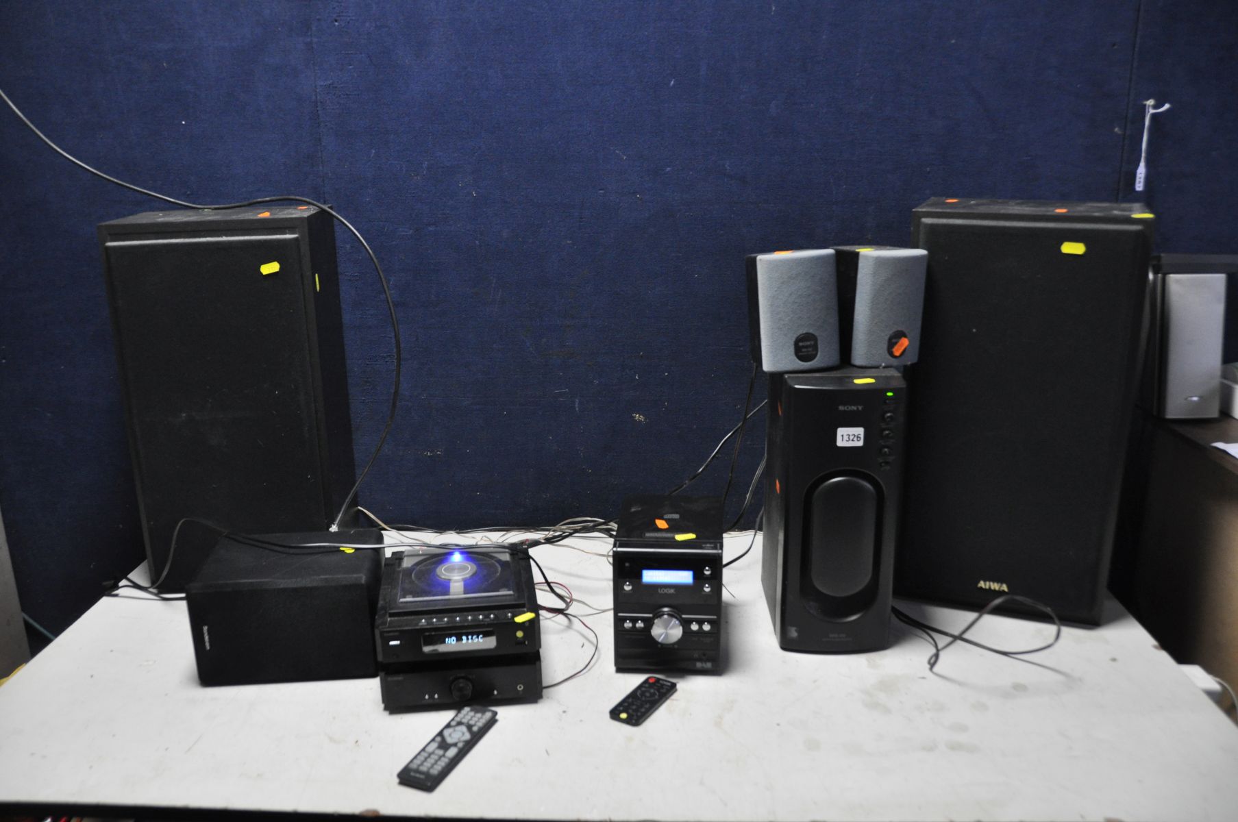 A SONY SRS D2 SUB AND SATELLITE SPEAKERS, a Logik hi fi, a Sandstrom Hi Fi with one speaker, a