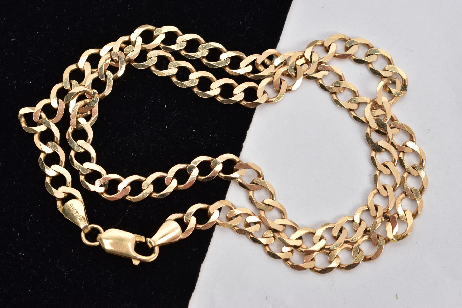 A 9CT GOLD CHAIN NECKLACE, a flat curb link chain, approximate width 6mm, fitted with a lobster claw