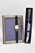 A SILVER PHOTO FRAME, WRISTWATCH AND A CAKE KNIFE, the frame of a rectangular form, measuring