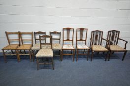 AN EDWARDIAN MAHOGANY ELBOW CHAIR with open armrests, two splat back chairs, and five other