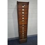 AN AMBERG EARLY 20TH CENTURY OAK FIVETEEN DRAWER FILING CABINET with central brushing slide, and