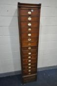 AN AMBERG EARLY 20TH CENTURY OAK FIVETEEN DRAWER FILING CABINET with central brushing slide, and