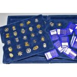 A MAYFAIR CASED THE AUTHENTIC US POLICE BADGE COLLECTION, comprising twenty eight miniature police