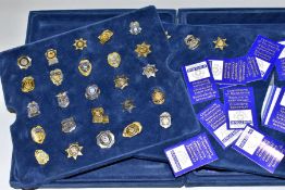 A MAYFAIR CASED THE AUTHENTIC US POLICE BADGE COLLECTION, comprising twenty eight miniature police