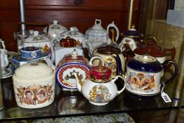 A GROUP OF ROYAL COMMEMORATIVE TEAPOTS, TEA CADDIES AND BISCUIT BARRELS, mainly twentieth century to