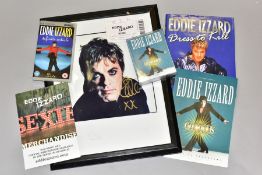 A BOX AND LOOSE EDDIE IZZARD ITEMS, comprising a framed limited edition signed photograph numbered