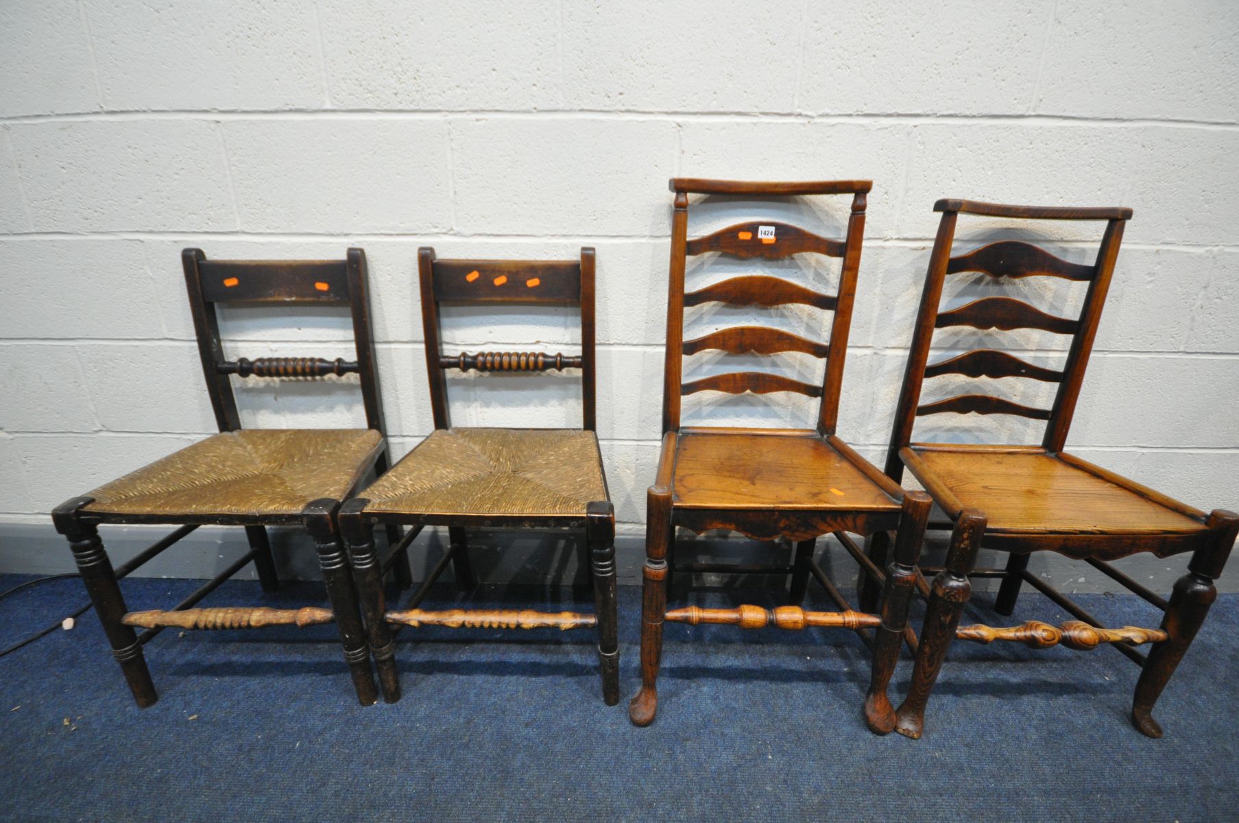 TWO GEORGIAN ELM LADDER BACK CHAIRS, and two Georgian rush seated chairs (4)
