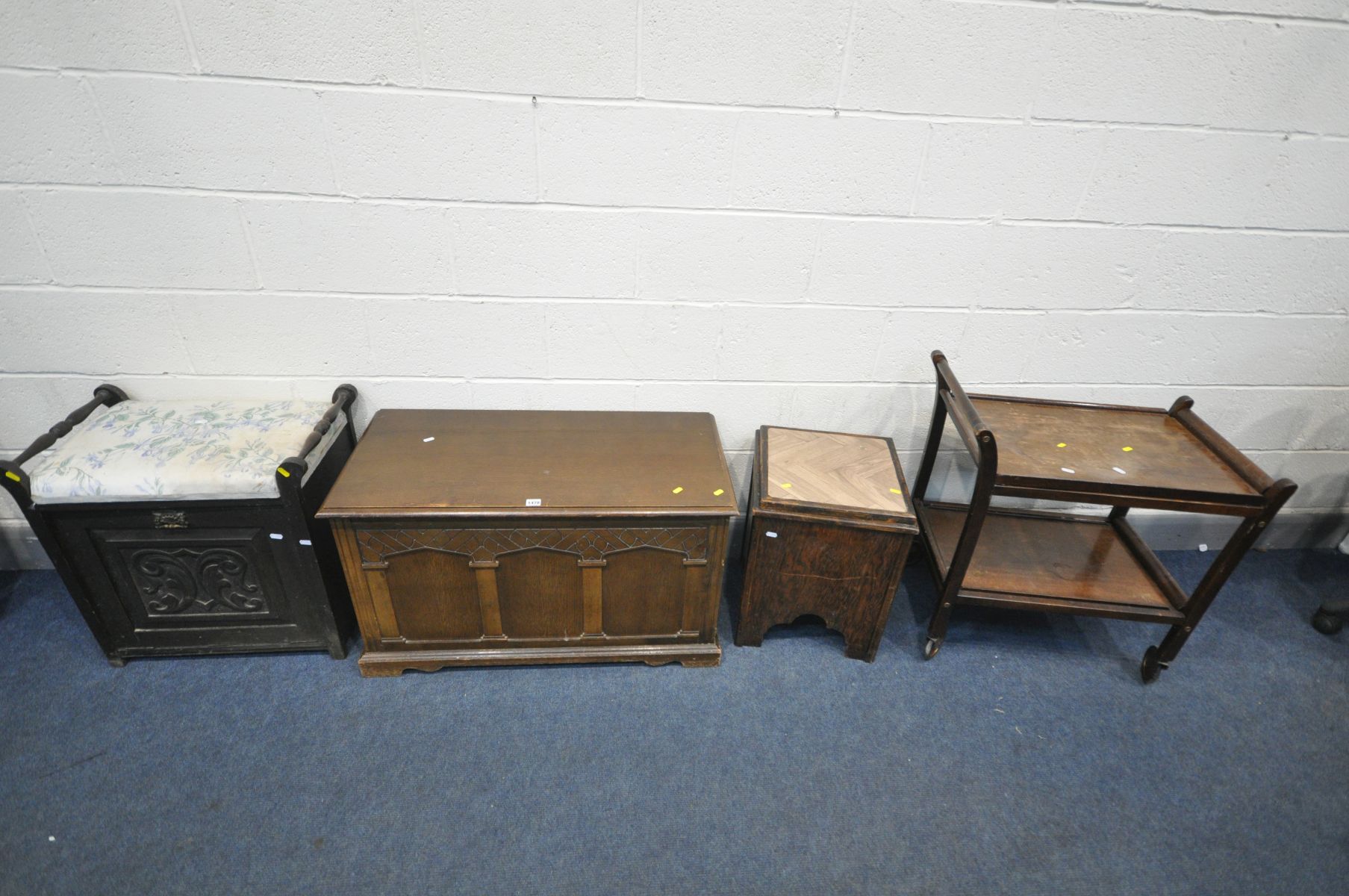 AN OAK BLANKET CHEST, an Edwardian mahogany piano, beech tea trolley and an oak storage box (4)