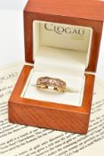 A 9CT GOLD CLOGAU LIMITED EDITION TRILLOGY RING, three round brilliant cut diamonds, bezel set in