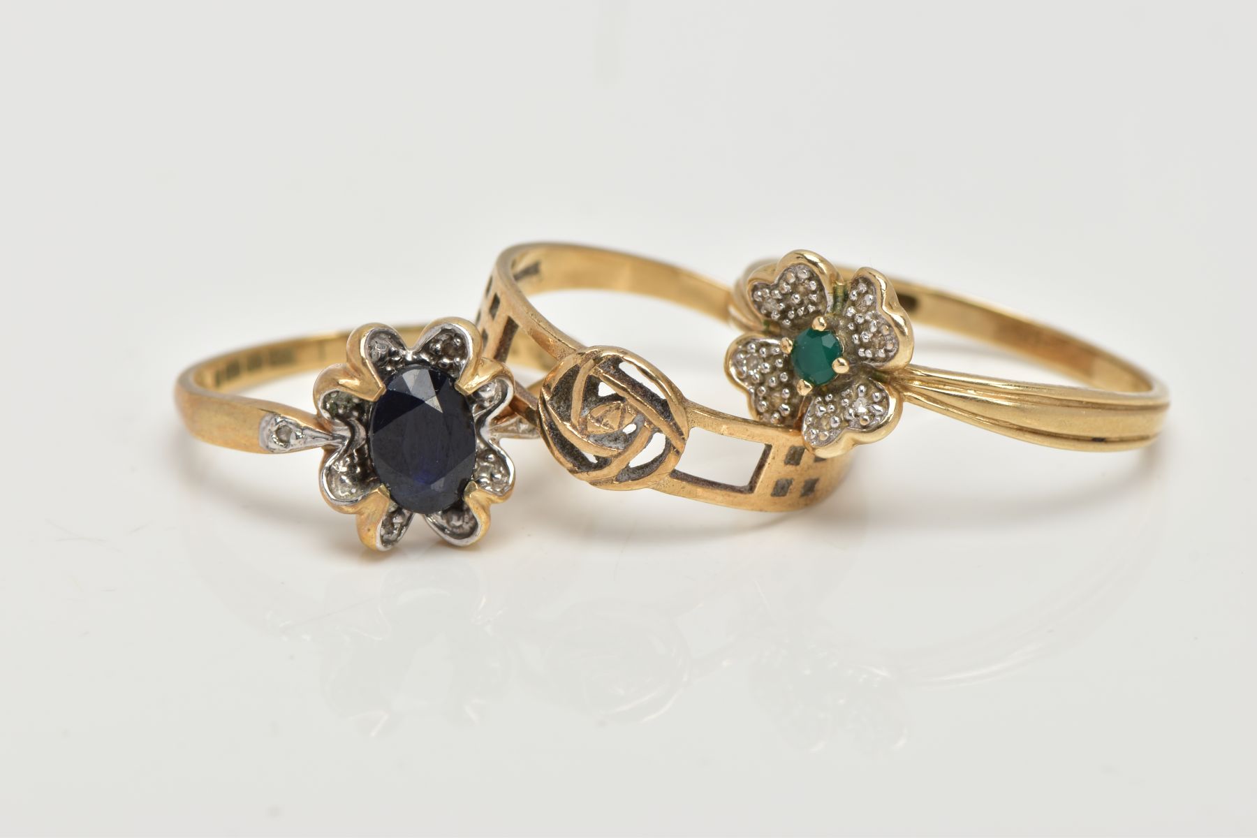 THREE 9CT GOLD RINGS, the first set with an oval cut blue sapphire, within a floral surround set - Image 2 of 3