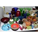 A QUANTITY OF COLOURED AND DECORATED GLASSWARES, to include a marigold carnival glass punch bowl