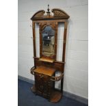 AN EDWARDIAN STYLE HARDWOOD HALL STAND, with a central bevelled edge mirror, four brass hooks, and a