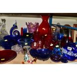 A QUANTITY OF DECORATIVE COLOURED GLASS, to include Caithness vases, Mdina paperweight with etched