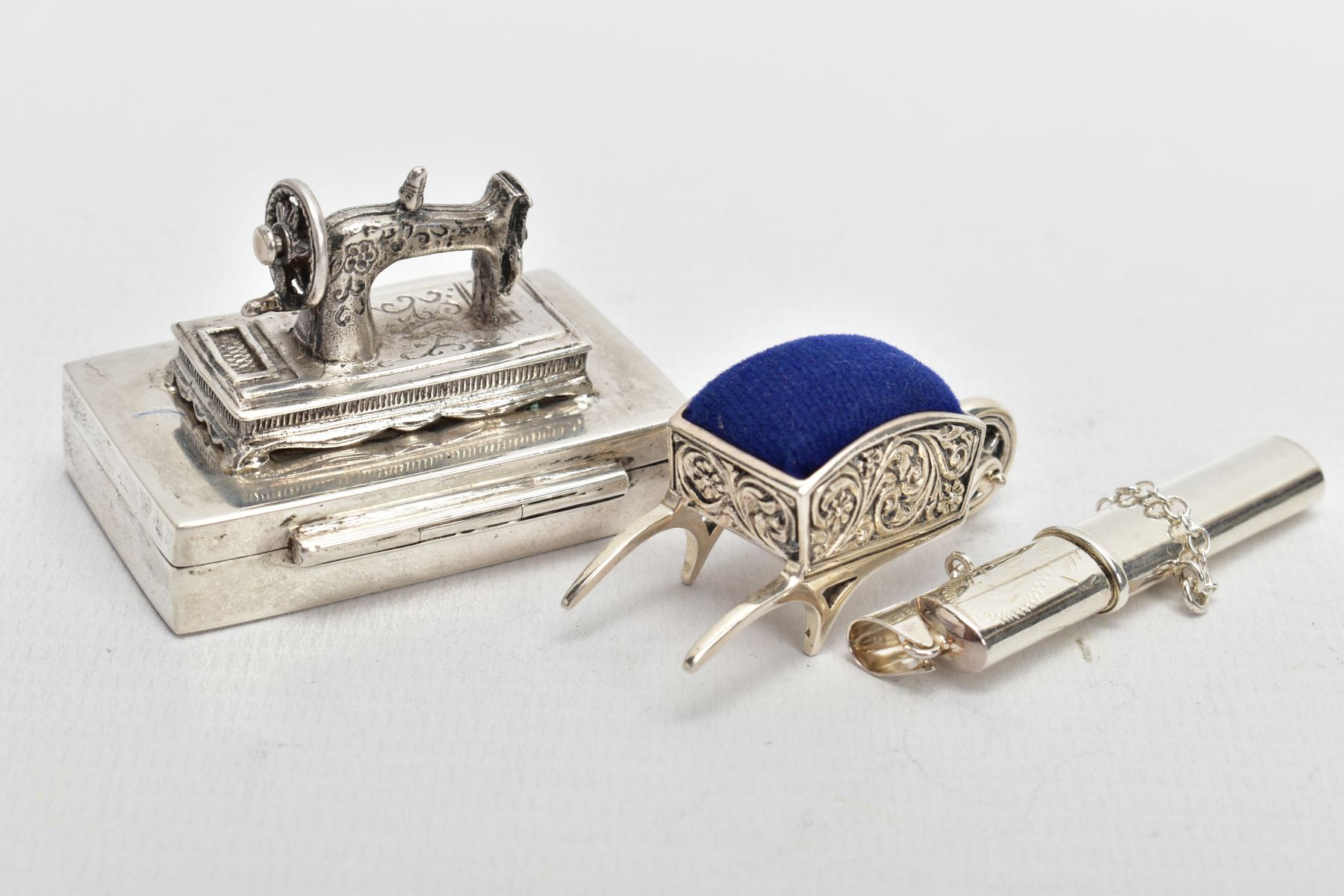 THREE WHITE METAL ITEMS, to include a silver sewing needle box fitted with a sewing machine to the - Image 3 of 5