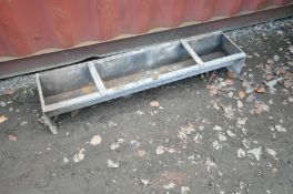 A GALVANISED AND STEEL ANIMAL FEED TROUGH, 138cm wide x 32cm deep x 21cm high