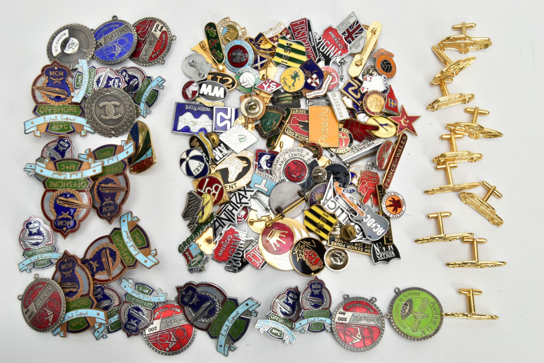 A BOX OF ASSORTED BADGES AND CUFFLINKS, to include a bag of car inspired cufflinks, a bag of